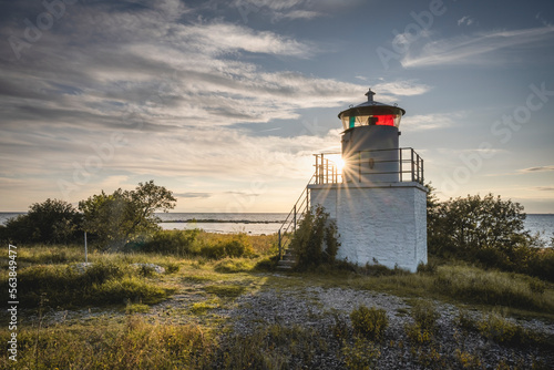 Sweden, Oland, Byxelkrok, Tokenasudde Lighthouse at sunset photo