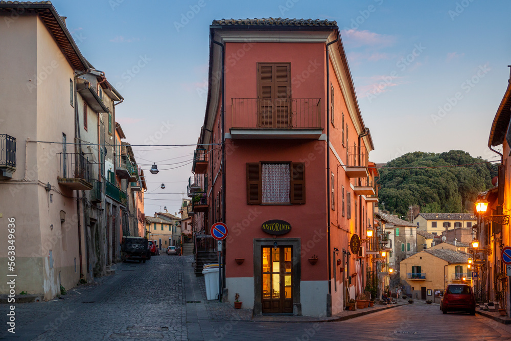 Italy, Lazio, Capodimonte, Restaurant between two alleys at dusk Italy, Lazio, Capodimonte, Restaurant between two alleys at dusk