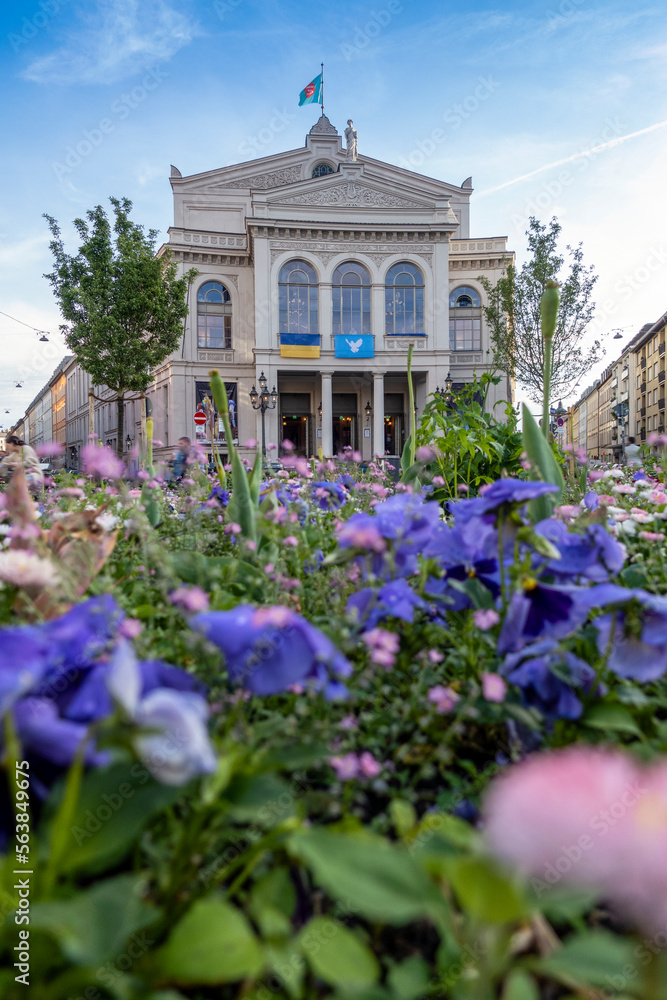 Germany, Bavaria, Munich, Facade ofGartnerplatztheateropera house with flowerbed in foreground Germany, Bavaria, Munich, Facade ofGartnerplatztheateropera house with flowerbed in foreground