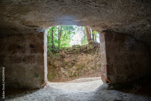 Ancient cave in front of walkway photo