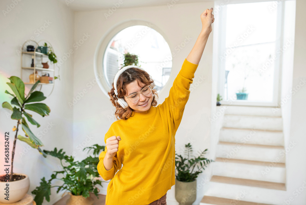 Smiling young woman having fun dancing at home Smiling young woman having fun dancing at home
