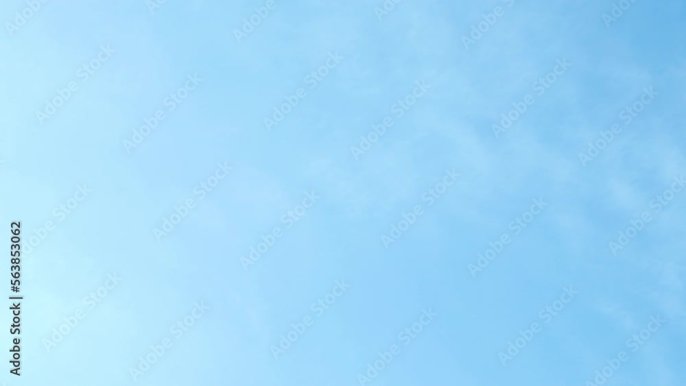 Beautiful View of Clear Blue Azure Sky and Cirrus Light White Clouds Time Lapse. Abstract Light Blue Sky Background, Blue Skyscraper, Light Cloud Sunlight Sunny Day. Beautiful View of Clear Blue Azure Sky and Cirrus Light White Clouds Time Lapse. Abstract Light Blue Sky Background, Blue Skyscraper, Light Cloud Sunlight Sunny Day.