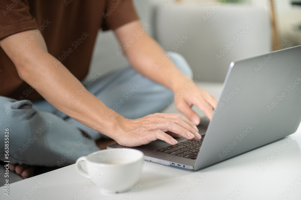 Fototapeta premium Man work from home. work online on laptop. Asian businessman working online business concept with social distancing laptop online meeting.