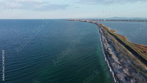 Wallpaper Mural Bird's eye view of beach with sand, grass and stones washed by bay of Black Sea and lake under sky in sunset light Torontodigital.ca