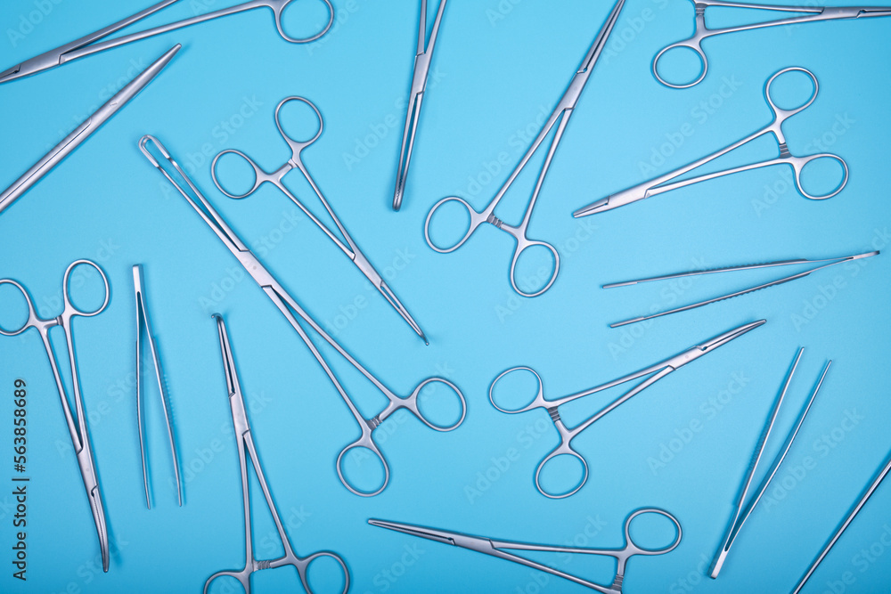 Fototapeta premium Surgical instruments on a blue.