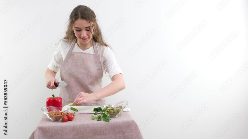 Smiling young woman serving fresh salad on plate. Happy smiling cute woman cooking fresh healthy vegan salad at home with many vegetables in kitchen and trying new recipe High quality photo Smiling young woman serving fresh salad on plate. Happy smiling cute woman cooking fresh healthy vegan salad at home with many vegetables in kitchen and trying new recipe High quality photo