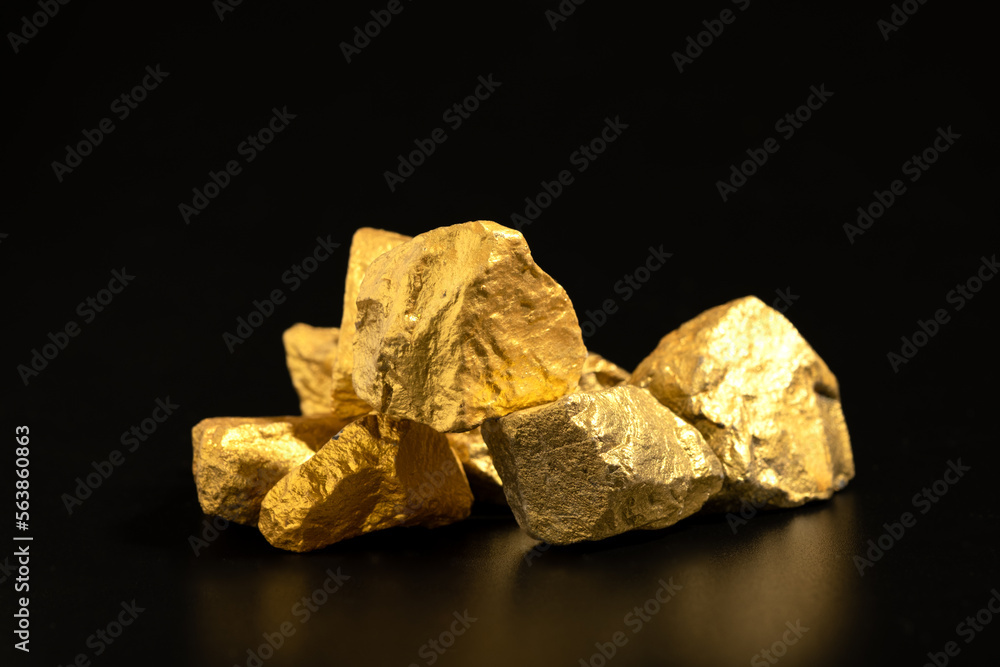 The pure gold ore found in the mine on black background The pure gold ore found in the mine on black background
