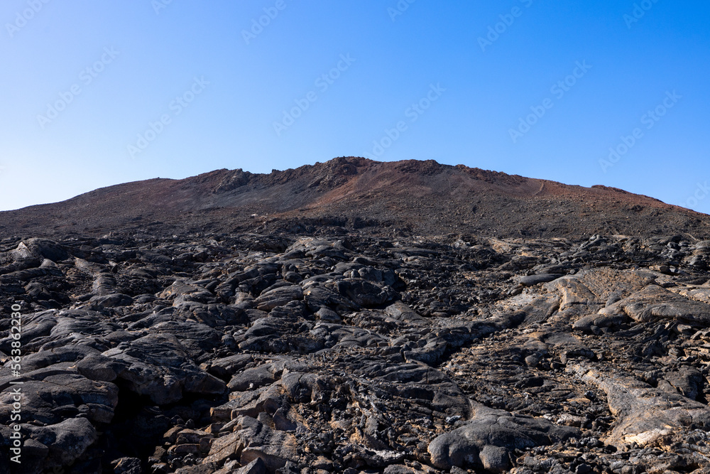Views across the black lava volcano field of Jabal Qidr in the Harrat Khaybar region, north west Saudi Arabia Views across the black lava volcano field of Jabal Qidr in the Harrat Khaybar region, north west Saudi Arabia