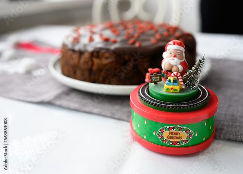 Obraz na płótnie Aged cake, with dried fruit and brandy. Traditional aged English fruitcake for Christmas. Chocolate covered with guji berries. Christmas cake with alcohol. Very tasty, perfect for the festive table. w salonie