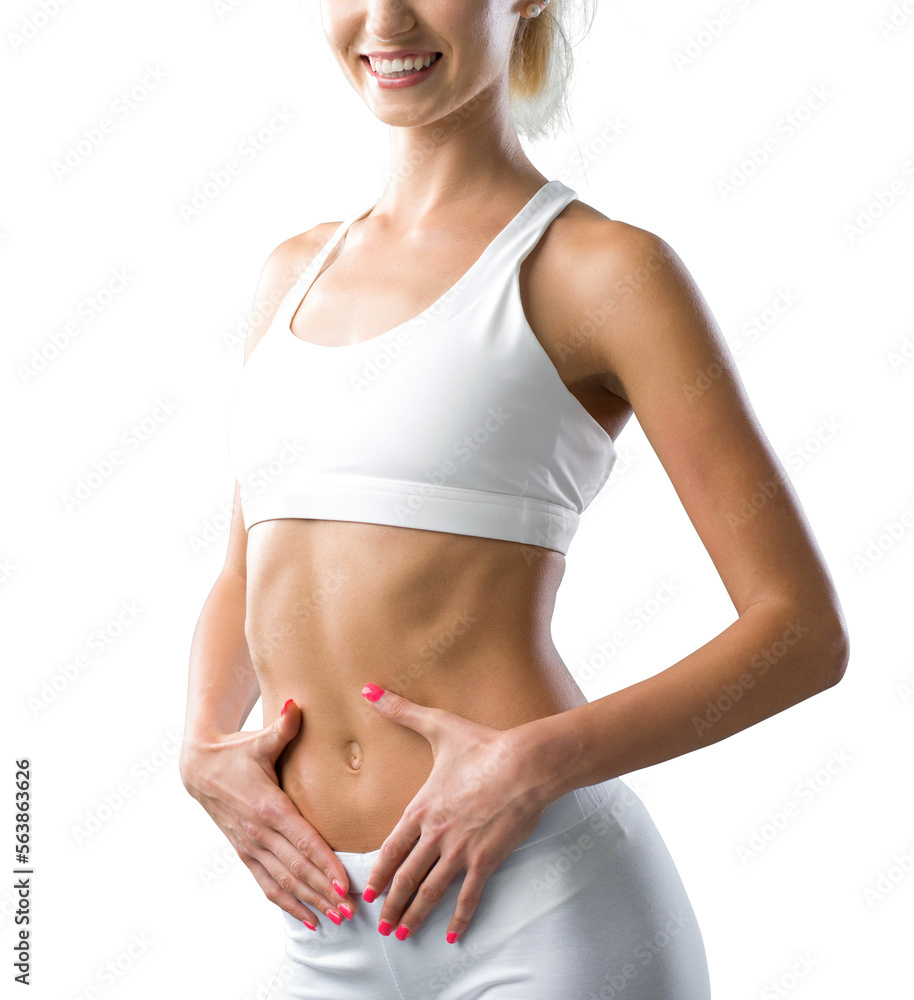 Beautiful fit woman touching her belly - obrazy, fototapety, plakaty 