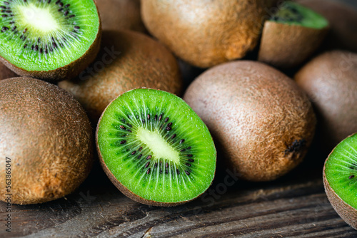 Ripe fruits of kiwi cut and whole, close -up.