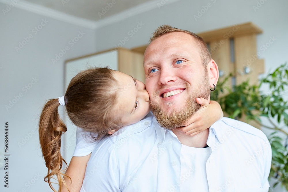 Father and daughter in white spending time at home Father and daughter in white spending time at home