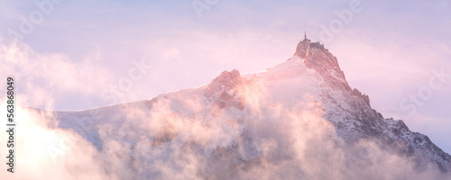 French Alps, Aiguille du Midi, Chamonix Mont-Blanc, France. Fantastic evening snow mountains landscape banner background
