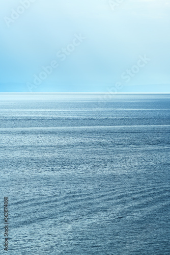 Morning sunlight beaming through clouds at Kvarner gulf of Adriatic sea in Croatia