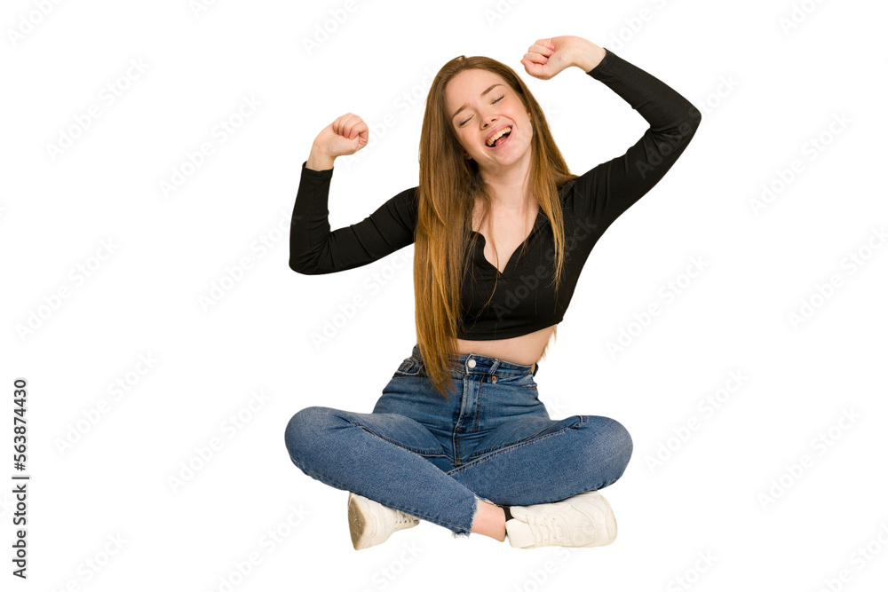 Young redhead woman sitting on the floor cut out isolated afraid covering eyes with hands. Young redhead woman sitting on the floor cut out isolated afraid covering eyes with hands.