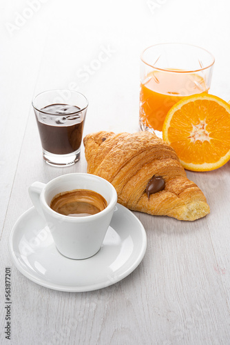 Breakfast with coffee, orange juice and chocolate brioches