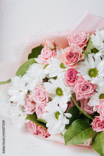 Background of beautiful bouquet of rose and chrysanthemums flowers. Backdrop for holiday, birthday, Wedding, Mother's Day, Valentine's day, Women's Day. Floral arrangement.