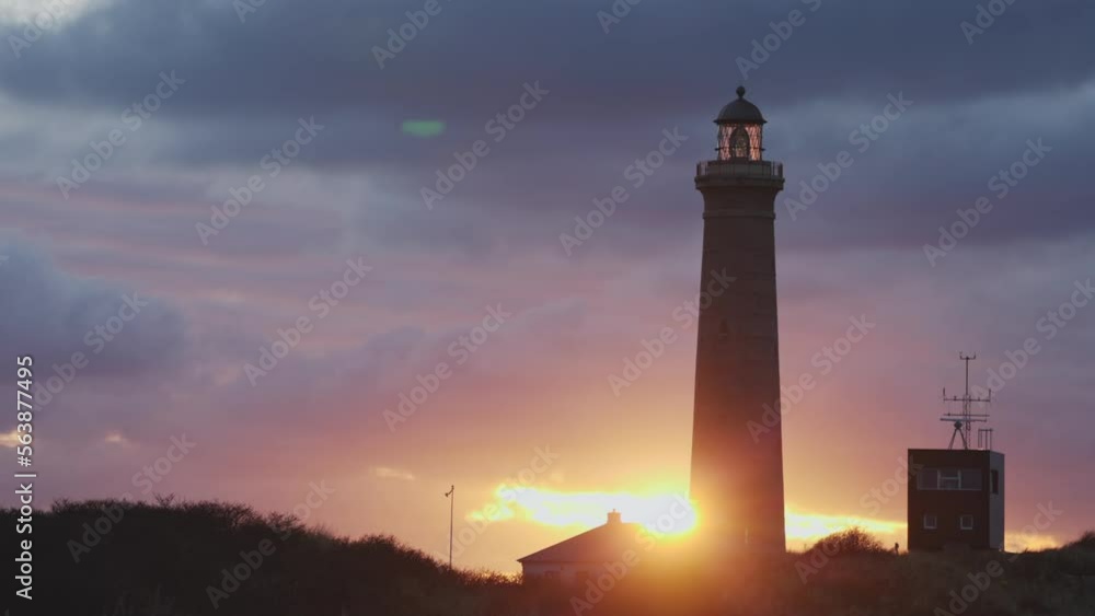 sun going down behind a lighthouse sun going down behind a lighthouse