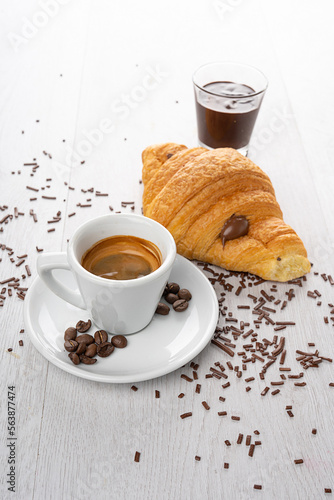 Fototapeta Naklejka Na Ścianę i Meble -  breakfast with coffee and chocolate croissant brioches on a light background