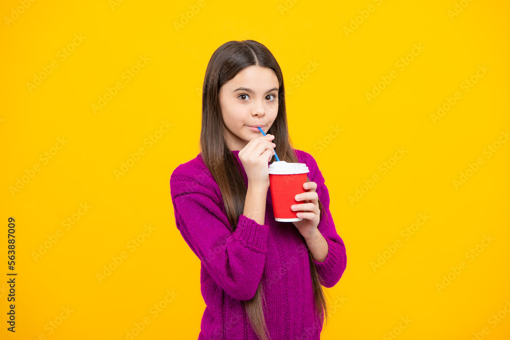 Kid girl 12, 13, 14 years old with take away cup of cappuccino coffee or tea. Child with takeaway mug on yellow background, morning drink beverage.