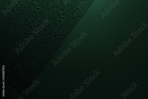 Shiny water drops on a black surface, green color, background, water drops on black, water drops on a black glass surface. Texture. View from above photo