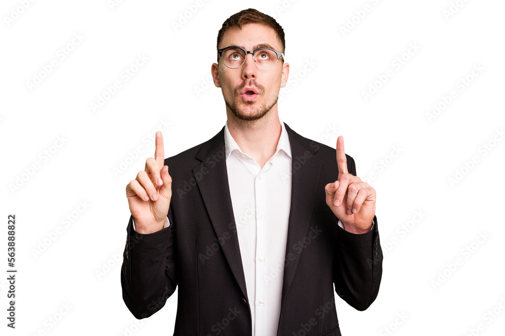 Young caucasian business man cutout isolated pointing upside with opened mouth. Young caucasian business man cutout isolated pointing upside with opened mouth.