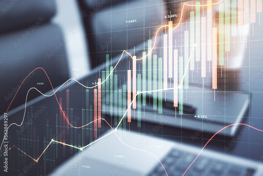 Multi exposure of abstract financial graph on laptop background, financial and trading concept Multi exposure of abstract financial graph on laptop background, financial and trading concept