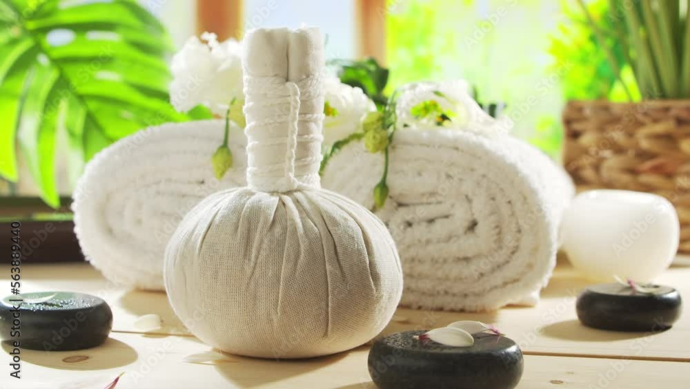 Spa background. Candles, flowers, massaging stones and herbal balls. Massage, oriental therapy, wellbeing and meditation concept. Spa background. Candles, flowers, massaging stones and herbal balls. Massage, oriental therapy, wellbeing and meditation concept.
