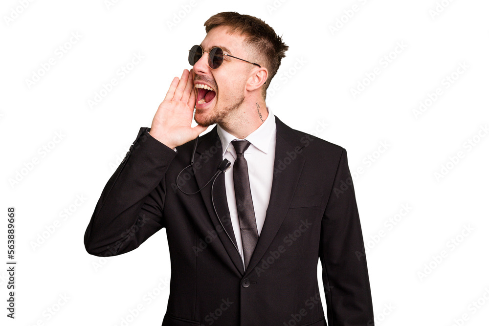 Security bodyguard man wearing a suit isolated cut out shouting and holding palm near opened mouth. Security bodyguard man wearing a suit isolated cut out shouting and holding palm near opened mouth.