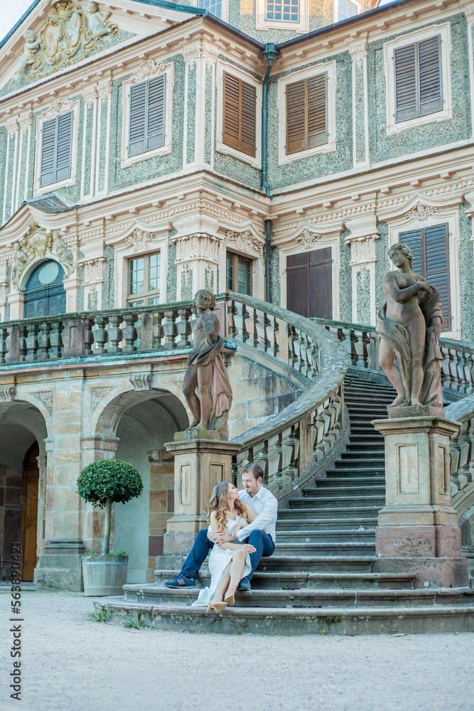 Beautiful young couple in love near the old palace. Wedding. Relationship.