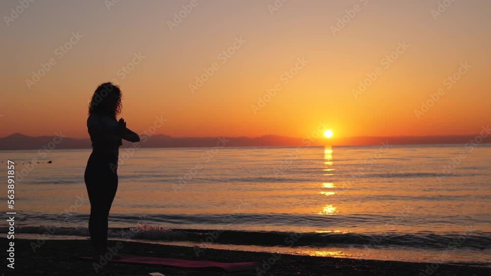 Young woman stretching near the sea Young woman stretching near the sea