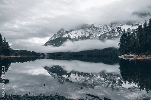 Bild auf Leinwand Lake reflection of mountains and forest