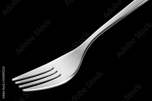 Silver fork close-up, isolated on black background