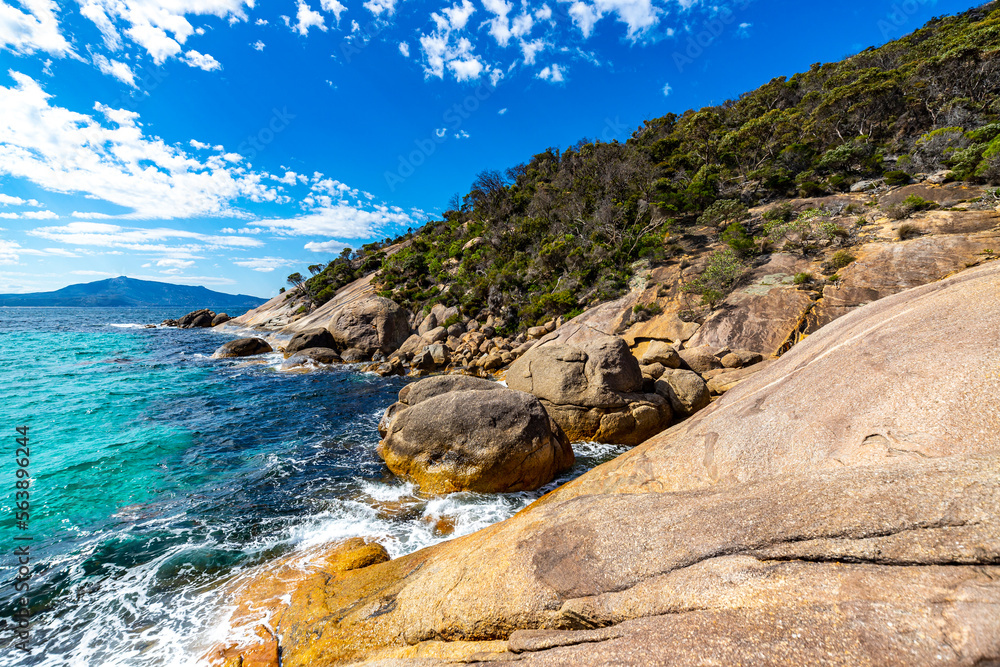 panorama of waterfall beach in two peoples bay nature reserve in western australia; paradisiacal hidden beach surrounded by hills near the city of albany