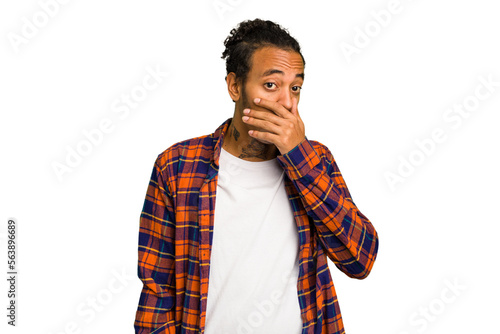 Young African American man isolated covering mouth with hands looking worried.