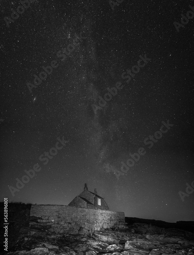 Winter Milky Way rising above a coastal boat house © Joe