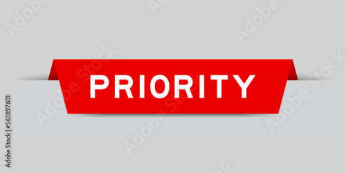 Red color inserted label with word priority on gray background