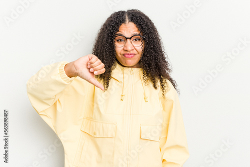 Young african american woman isolated on white background showing thumb down, disappointment concept. © Asier