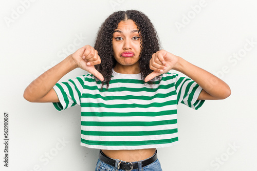 Young african american woman isolated on white background showing a dislike gesture, thumbs down. Disagreement concept.