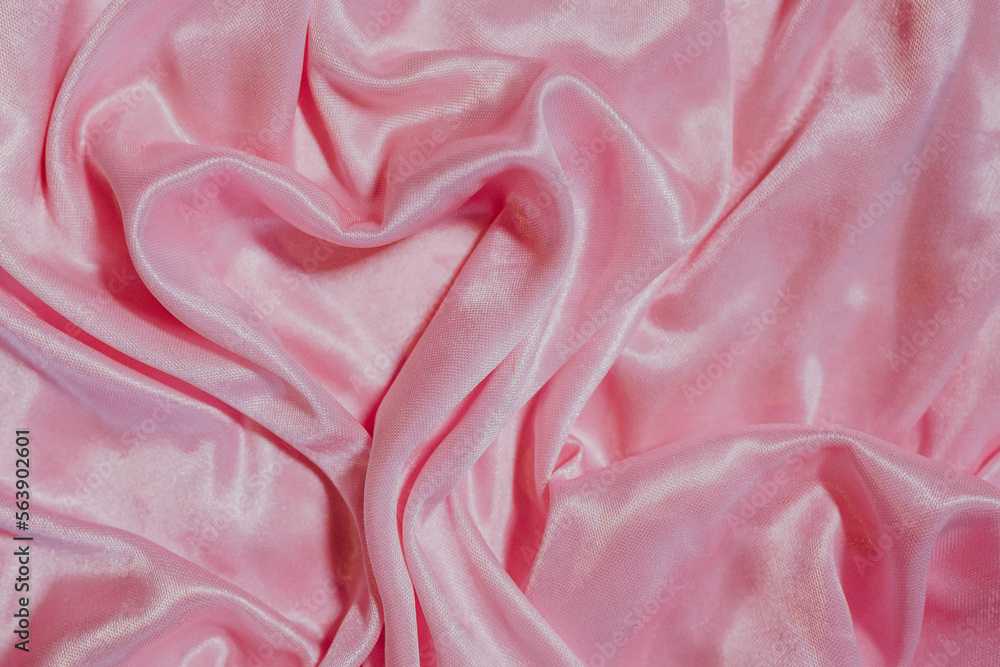 Obraz premium pink silk fabric background with heart. Valentine's day concept
