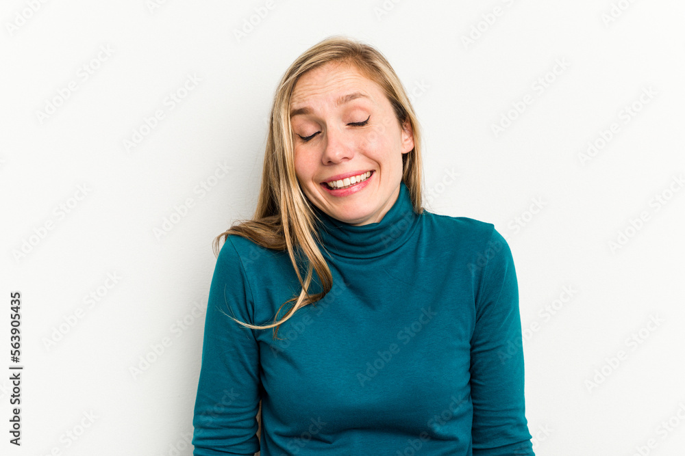 Young caucasian woman isolated on white background laughs and closes eyes, feels relaxed and happy. Young caucasian woman isolated on white background laughs and closes eyes, feels relaxed and happy.