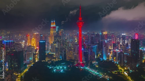 Wallpaper Mural 4K aerial hyperlapse of Kuala Lumpur cityscape during Chinese New Year Eve. KLCC and KL Tower lights up red and gold color. Year of the Rabbit Torontodigital.ca
