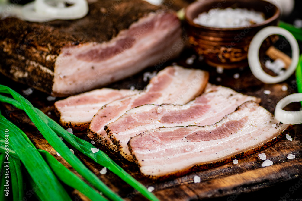 Pieces of lard on a cutting board.