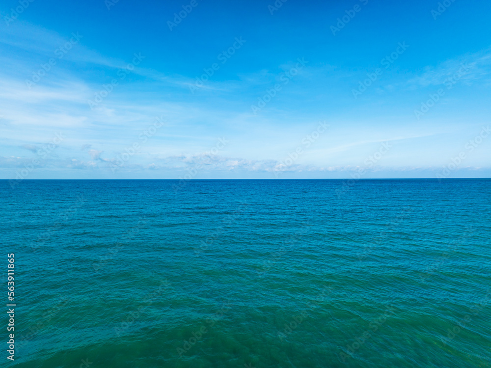 Aerial view of a blue sea surface water texture background,  Aerial view flying drone view Waves water surface texture in sunny day, tropical ocean blue sky background