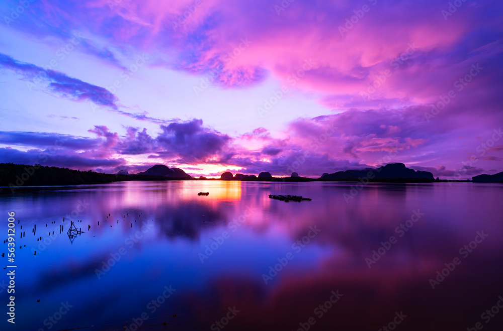 Fototapeta premium Landscape Long exposure of majestic clouds in the sky sunset or sunrise over sea with reflection in the tropical sea.Beautiful cloudscape scenery.Amazing light of nature Landscape nature background