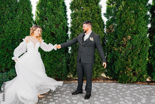 dancing bride and groom in the park © andrey