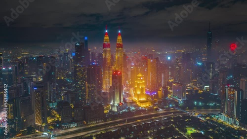Wallpaper Mural 4K aerial hyperlapse of Kuala Lumpur cityscape during Chinese New Year Eve. KLCC and KL Tower lights up red and gold color. Year of the Rabbit Torontodigital.ca