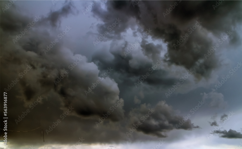 Raging clouds on the background of thunderclouds. thunderstorm front. The main object is blurred for the effect of dynamics.