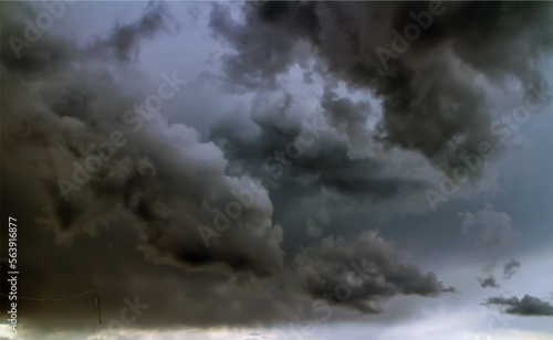 Raging clouds on the background of thunderclouds. thunderstorm front. The main object is blurred for the effect of dynamics.
