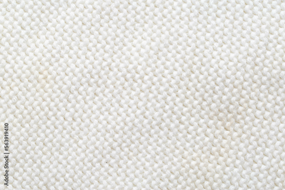 Comfortable warm knitted sweater made of white threads, background. Macro, handmade Comfortable warm knitted sweater made of white threads, background. Macro, handmade